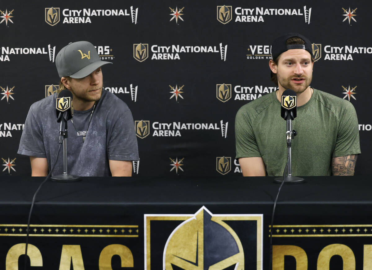 Golden Knights center William Karlsson, left, and goaltender Adin Hill listen to reporters ques ...