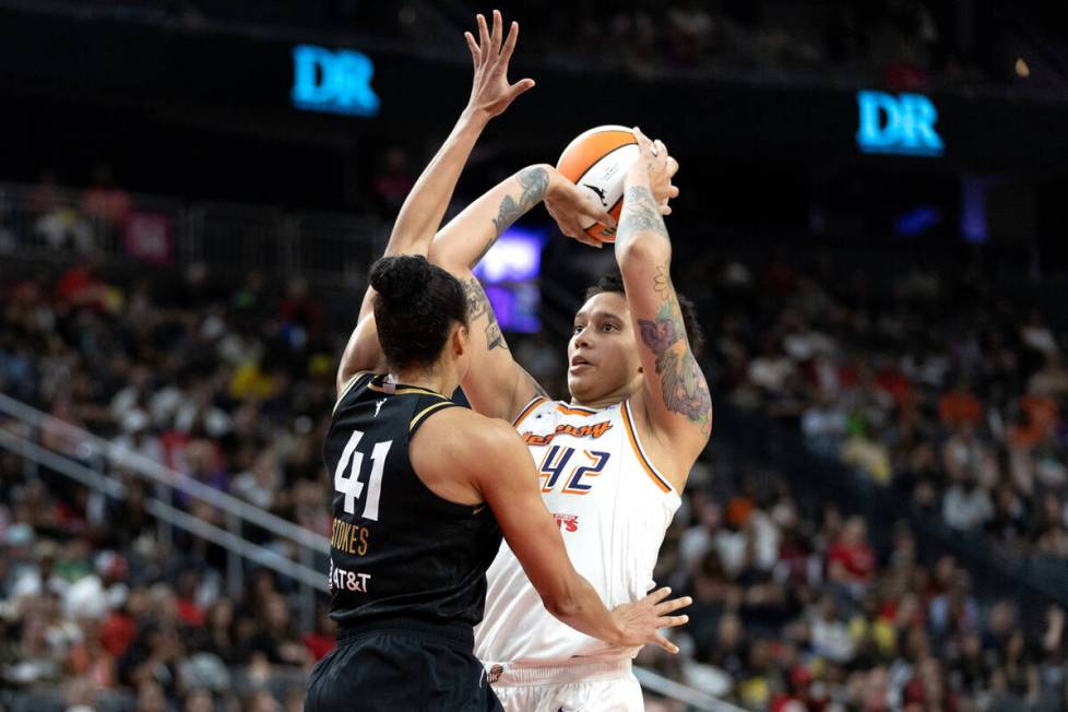 Phoenix Mercury center Brittney Griner (42) shoots against Las Vegas Aces center Kiah Stokes (4 ...