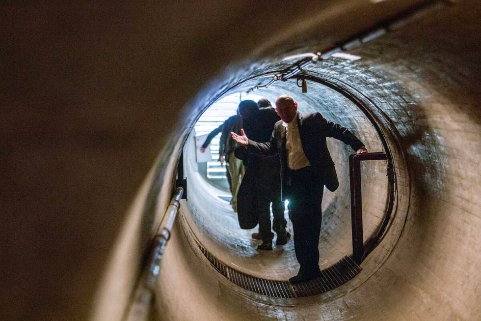 A tour moves through a maintenance tunnel on Dec. 13, 2019, at Hoover Dam. (Ellen Schmidt/Las V ...