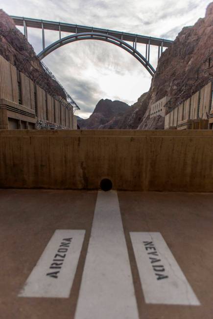 The Arizona-Nevada state line at the base of Hoover Dam is seen on Dec. 13, 2019. (Ellen Schmid ...