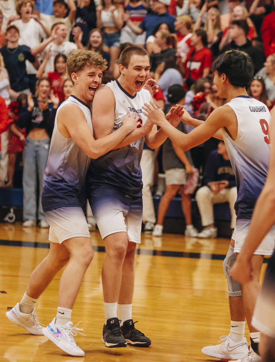 Coronado players celebrate winning the first set during a Class 5A high school boys volleyball ...