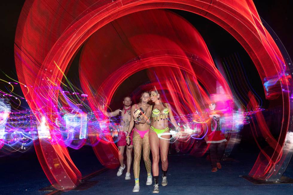 Attendees take selfies during the second day of the electronic dance music festival Electric Da ...