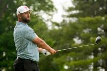 Jon Rahm, of Spain, watches his tee shot on the fifth hole during a practice round for the PGA ...