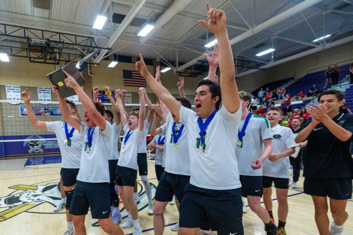 Palo Verde's players celebrate with the trophy after their match win against Coronado for the C ...