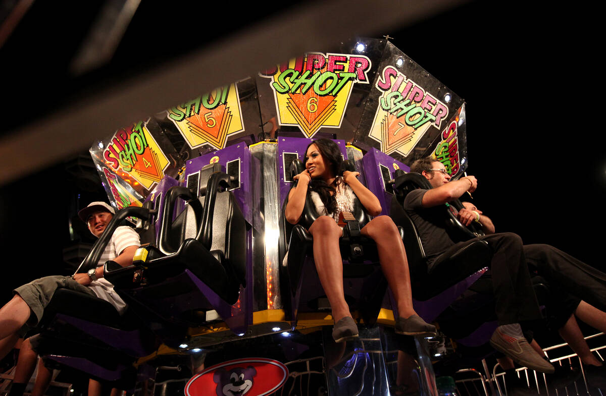 Ravegoers board a carnival ride the Electric Daisy Carnival at the Las Vegas Motor Speedway in ...