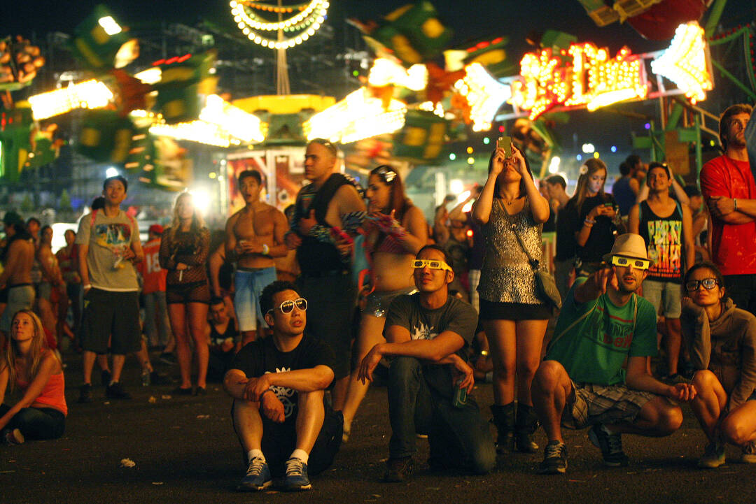 Festival goers watch fireworks on the third night of the Electric Daisy Carnival at the Las Veg ...