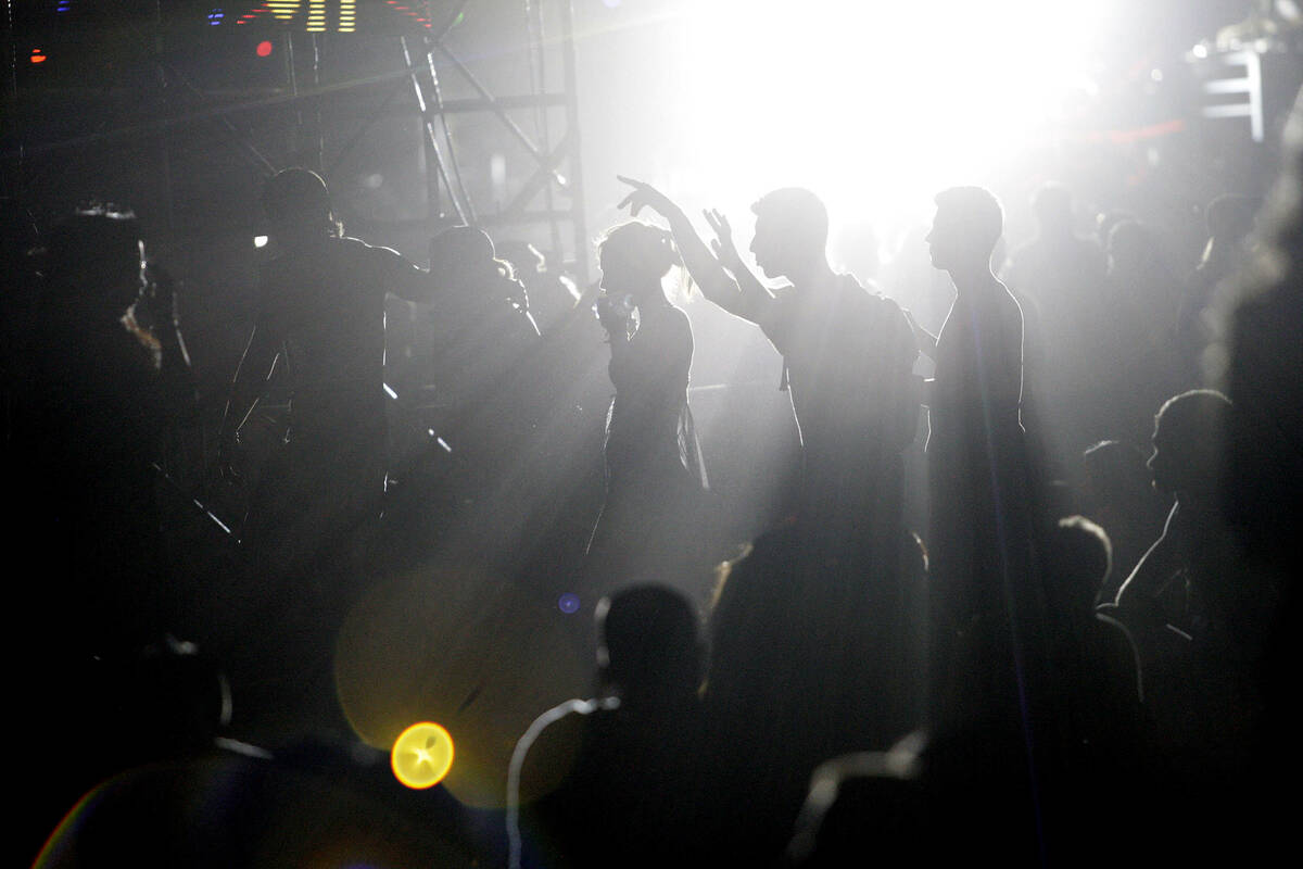 Revelers make their way through the crowd at the Electric Daisy Carnival at the Las Vegas Motor ...