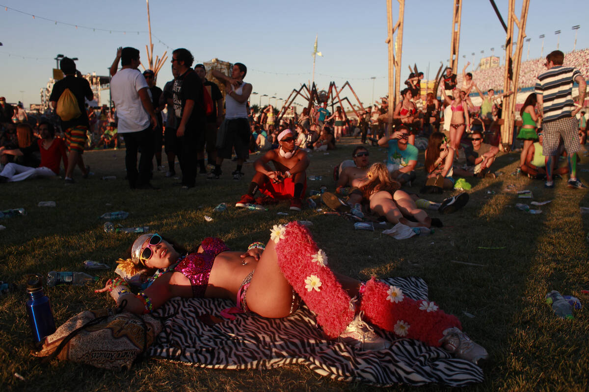 Lynnette Ariel Vazquez lays down during Boys Noize's set at cosmicMEADOW as the sun rises Sunda ...