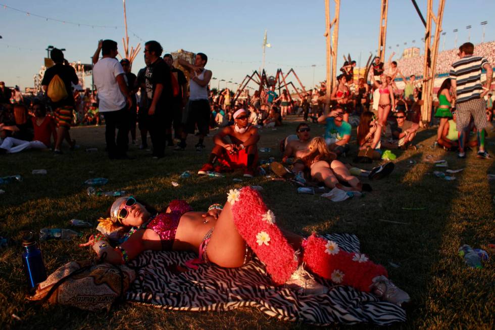 Lynnette Ariel Vazquez lays down during Boys Noize's set at cosmicMEADOW as the sun rises Sunda ...