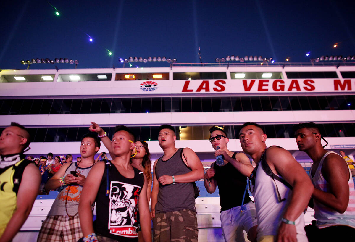 People walk into the Las Vegas Motor Speedway for the Electric Daisy Carnival in Las Vegas Frid ...