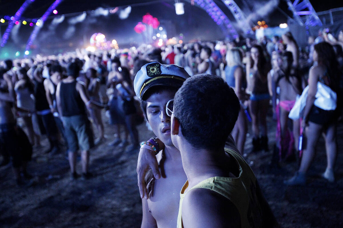 Miguel Contreras, in hat, and Jorge Speede embrace at the Electric Daisy Carnival at the Las Ve ...