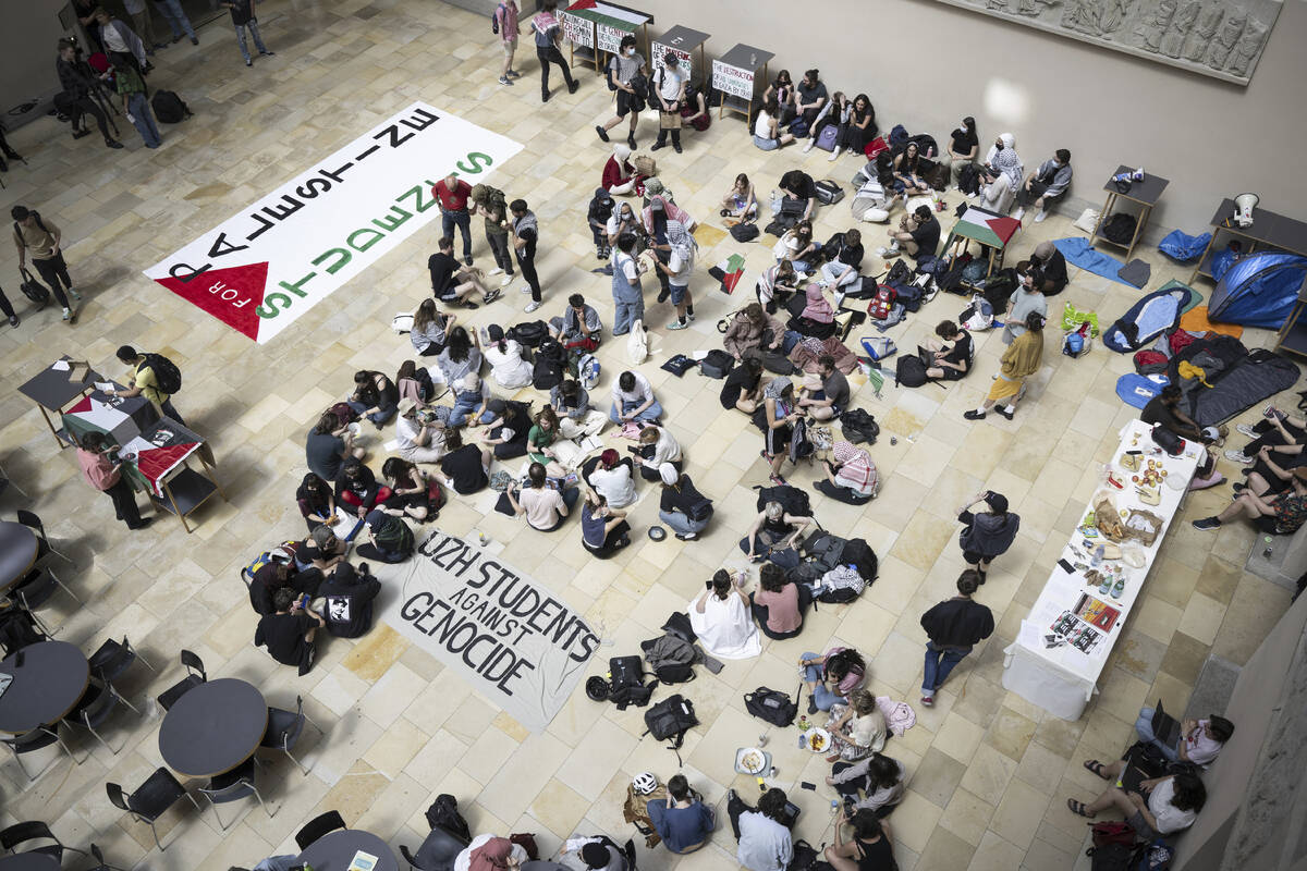 Pro-Palestinian demonstrators stage a protest in the entrance hall of the main building at the ...