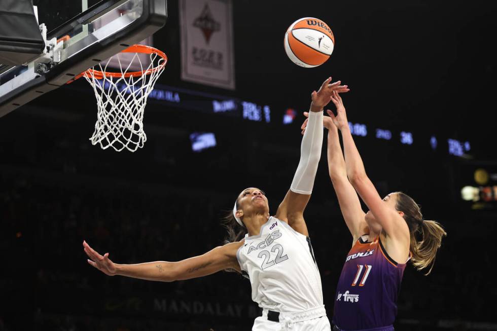 Las Vegas Aces center A'ja Wilson (22) blocks a shot by Phoenix Mercury guard Rebecca Allen (11 ...