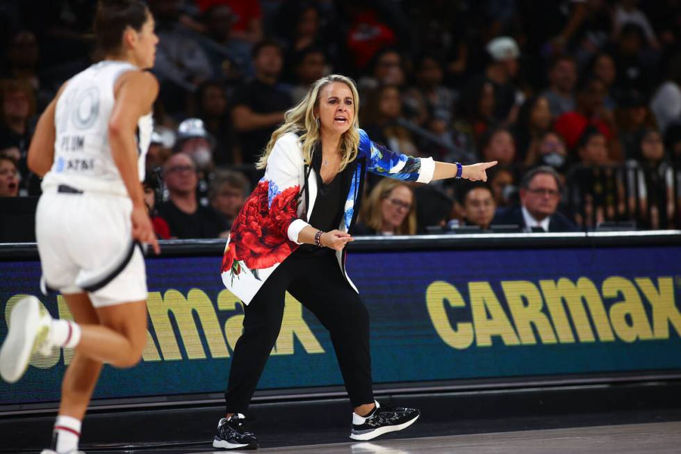 Las Vegas Aces head coach Becky Hammon shouts from the sideline during the first half of a WNBA ...