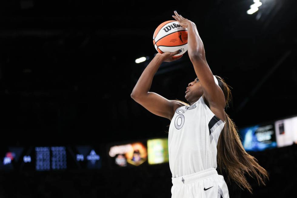 Las Vegas Aces guard Jackie Young (0) shoots a three-point basket during the second half of a W ...