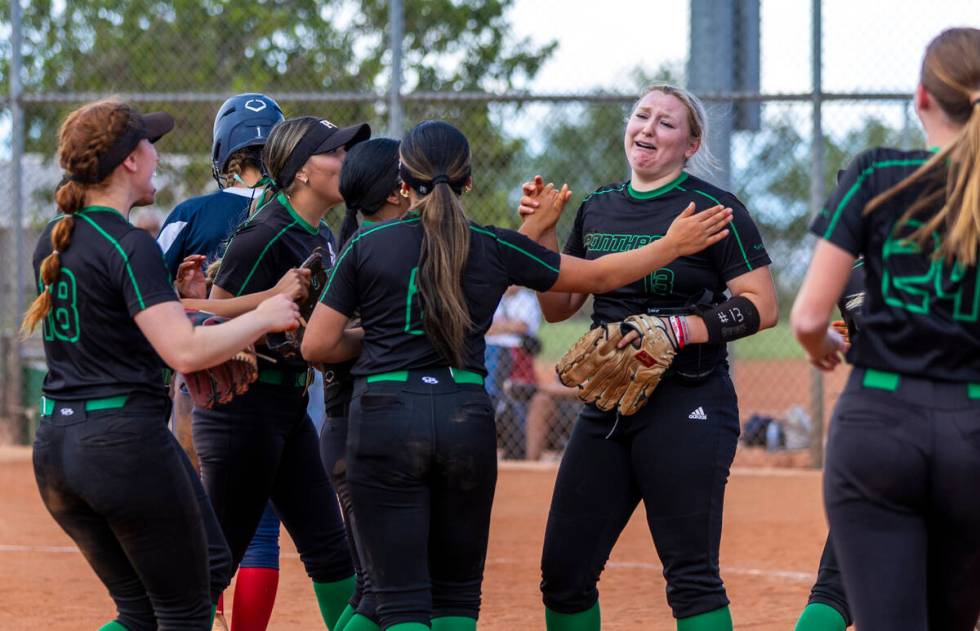 Palo Verde pitcher Bradi Odom (13) cries as teammates join her on the mound after defeating Cor ...