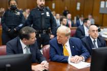 Former President Donald Trump, center, talks with his attorneys Todd Blanche and Emil Bove duri ...