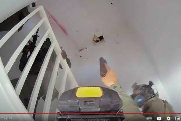 Video from a body-worn police camera shows Henderson police officers inside a townhome on April ...