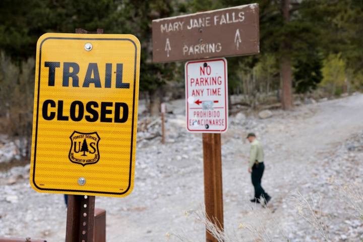 A U.S. Forest Service sign announces the Mary Jane Falls Trail is closed in the Spring Mountain ...