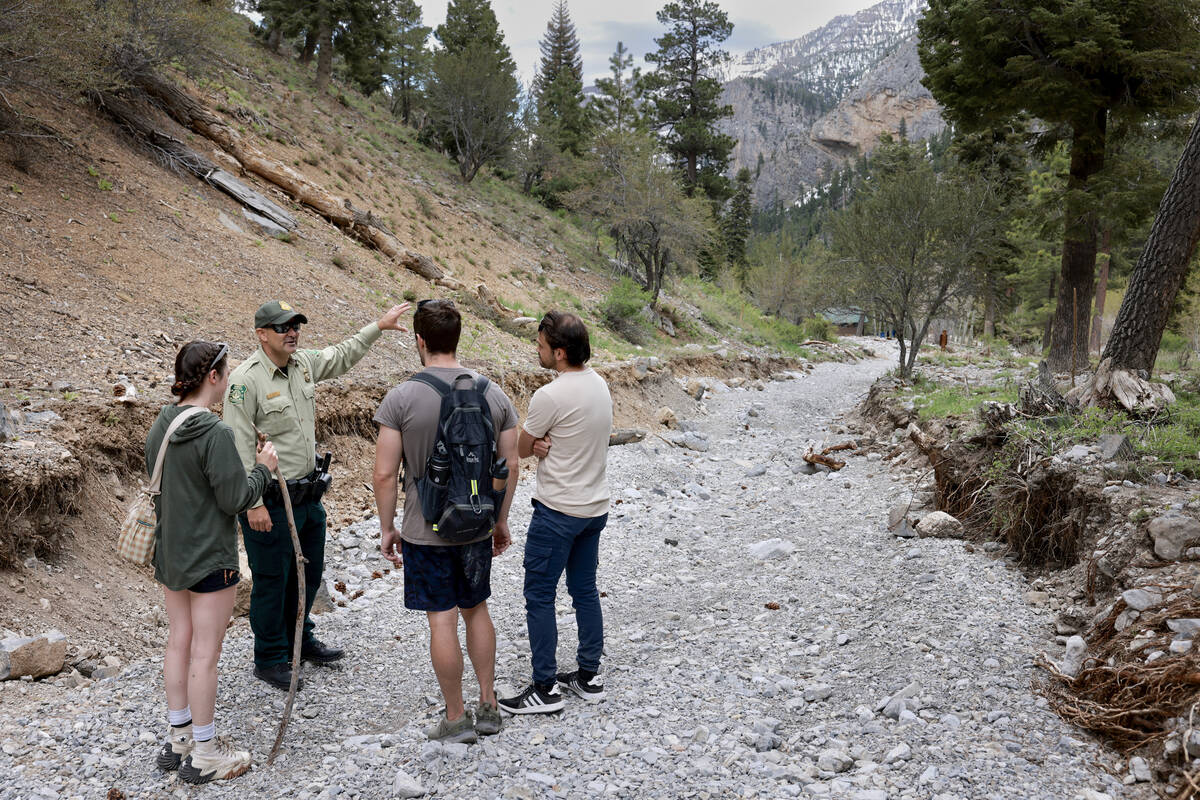 Nick Laprade, U.S. Forest Service law enforcement and investigations patrol captain, tells hike ...