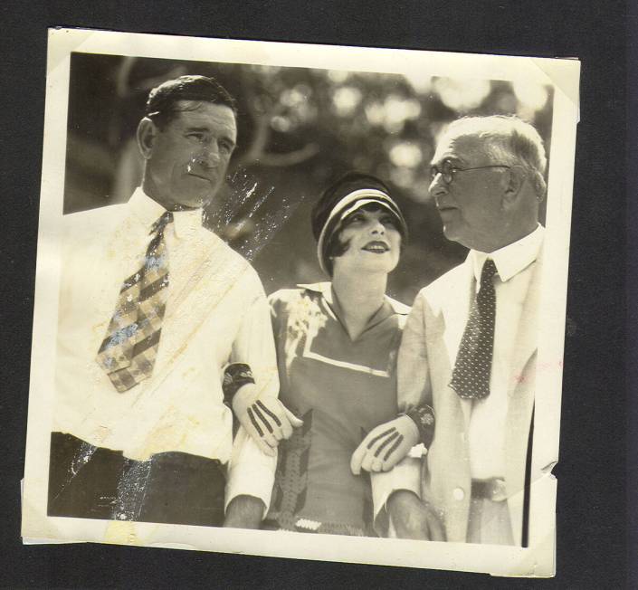 Clara Bow, center, with unidentified men in a photo from UNLV Special Collections’ “Walking ...