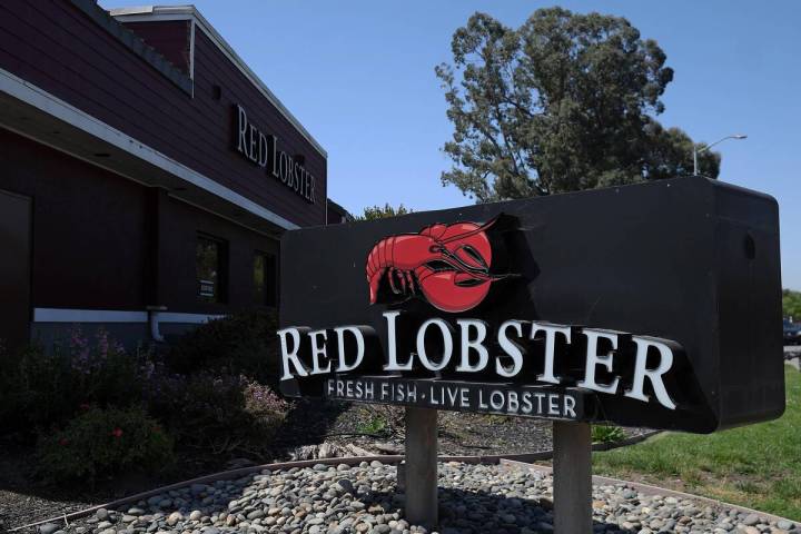 A sign is posted in front of a Red Lobster restaurant, announcing it's closure, on Tuesday, May ...