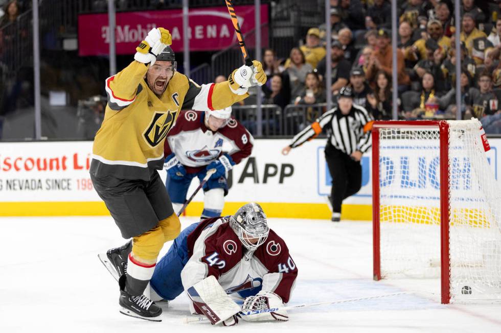 Golden Knights right wing Mark Stone (61) celebrates as he scores on Avalanche goaltender Alexa ...