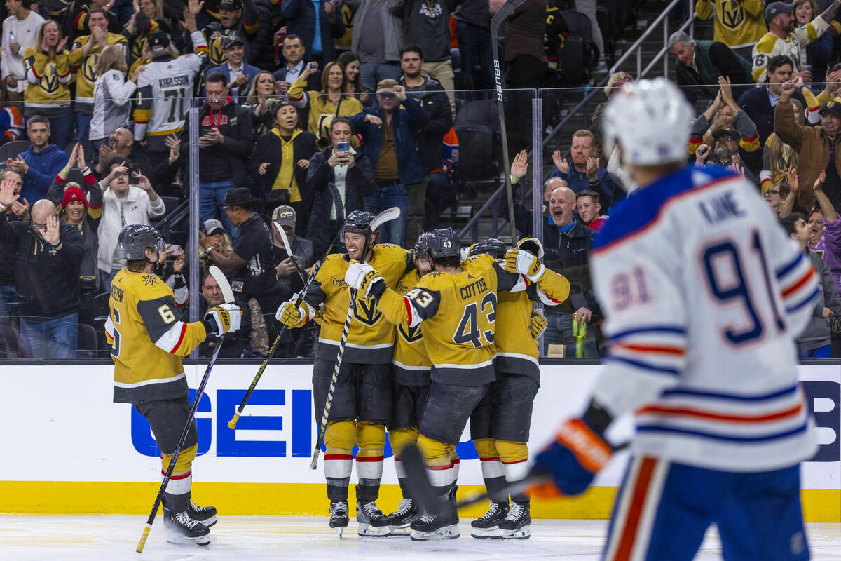 Golden Knights center Chandler Stephenson (20) is celebrated for a goal as Edmonton Oilers left ...