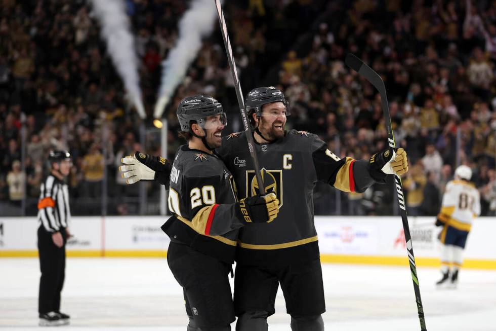 Vegas Golden Knights center Chandler Stephenson (20) and right wing Mark Stone (61) celebrate a ...