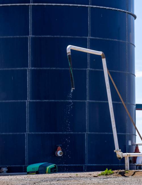 Water falls from a line beside an Aquastore glass-lined tank at Ponderosa Dairies on Wednesday, ...