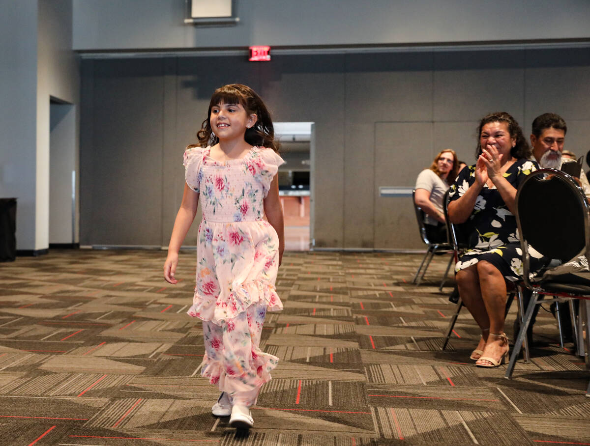 Second grade winner Daniela Quintero walks to the stage at the Las Vegas Review Journal’ ...