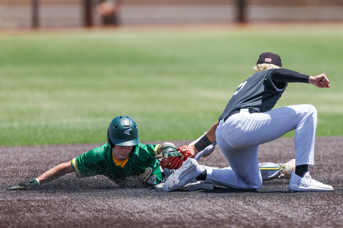 Palo Verde shortstop Ethan Clauss (25) gets an out on Bishop Manogue second baseman Cinco Guill ...