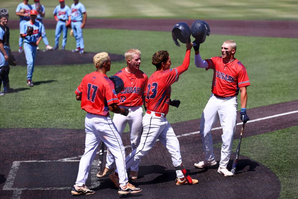 Coronado congratulates their infielder Matthew Moreno Jackson (23) after he hit a home run duri ...