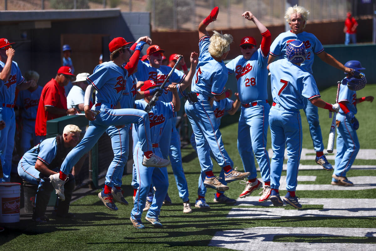 Reno celebrates after scoring during a Class 5A baseball state tournament opening round game ag ...