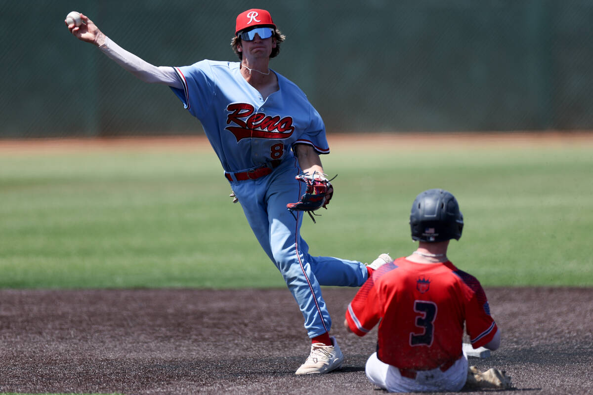 Reno infielder Harvey Smerdon (8) throws to first base after getting an out on Coronado outfiel ...