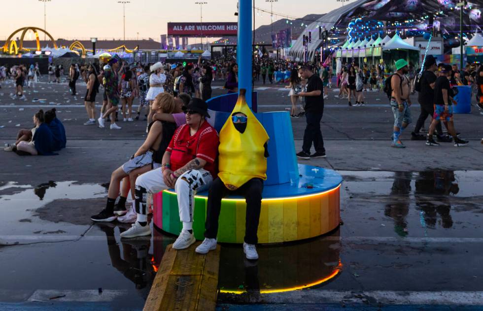 Festival attendees relax as the sun begins to rise during the second night of the Electric Dais ...