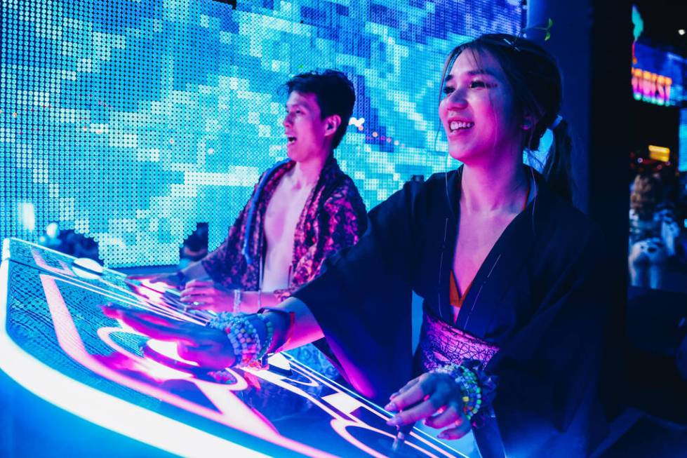 Festival attendees play a game during the second day of the Electric Daisy Carnival at the Las ...