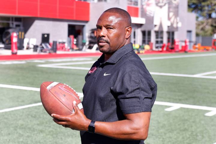 Former Rebel Hunkie Cooper, now a member of the staff, poses for a photo at Fertitta Football C ...