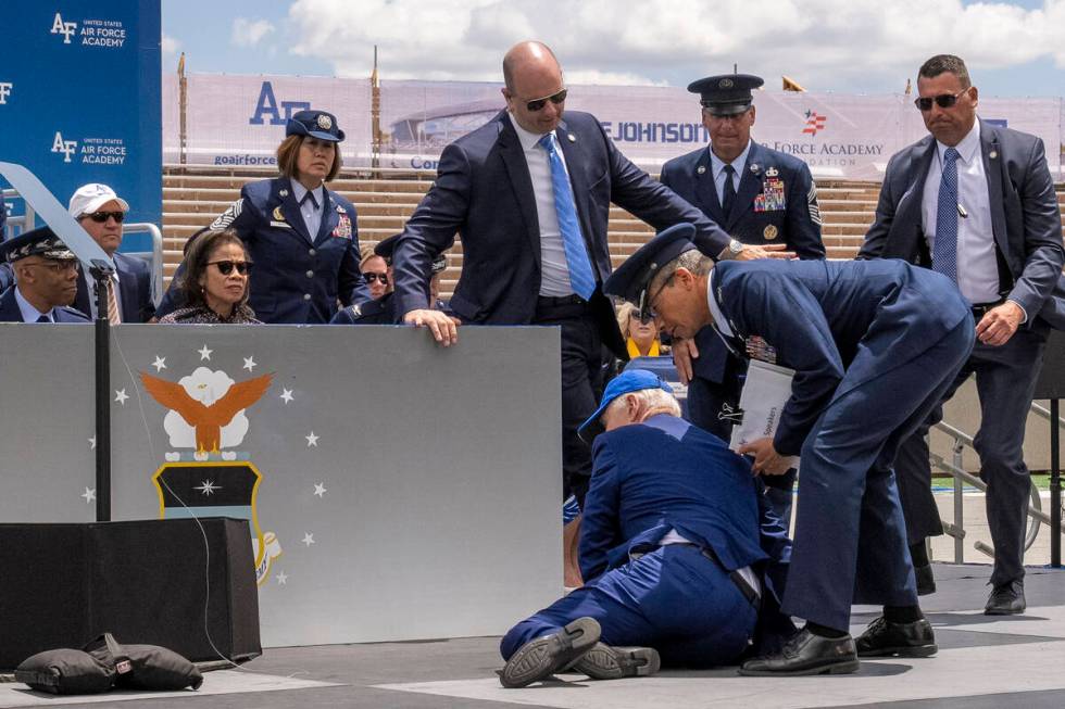 President Joe Biden falls on stage during the 2023 United States Air Force Academy Graduation C ...