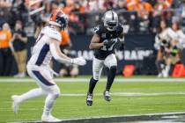 Raiders wide receiver Davante Adams (17) runs a route against the Denver Broncos during the fir ...