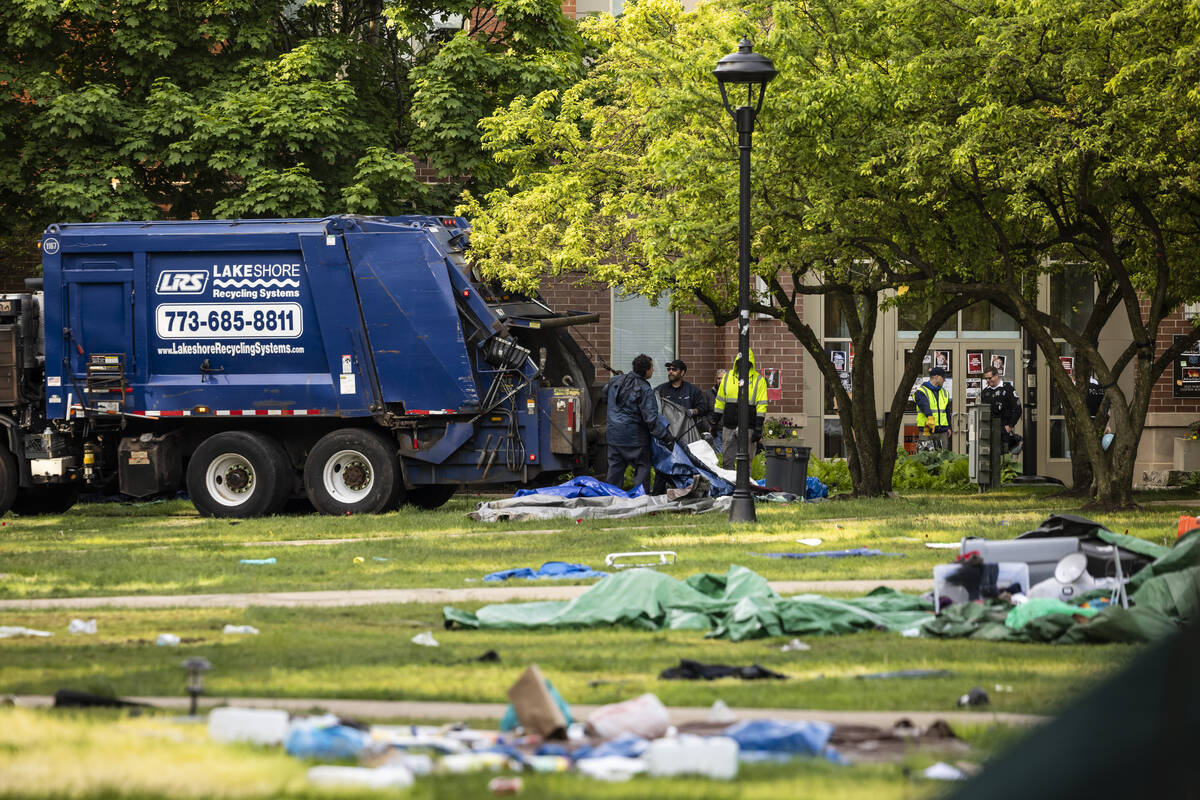 Crews disassemble the pro-Palestinian protest encampment in the quad at DePaul University's Lin ...