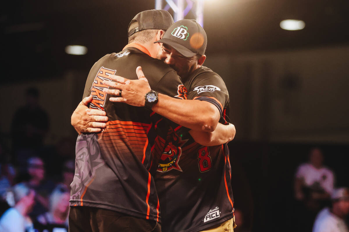 Texas Bully Baggers teammates hug during a professional cornhole matchup against the Las Vegas ...