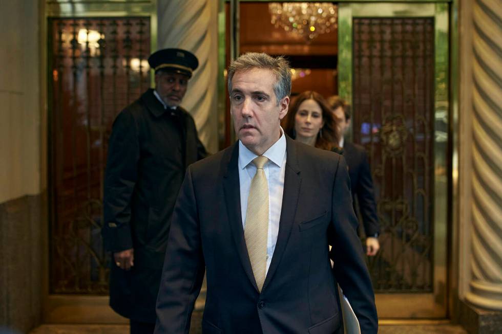 Michael Cohen departs his apartment building on his way to Manhattan criminal court, Thursday, ...