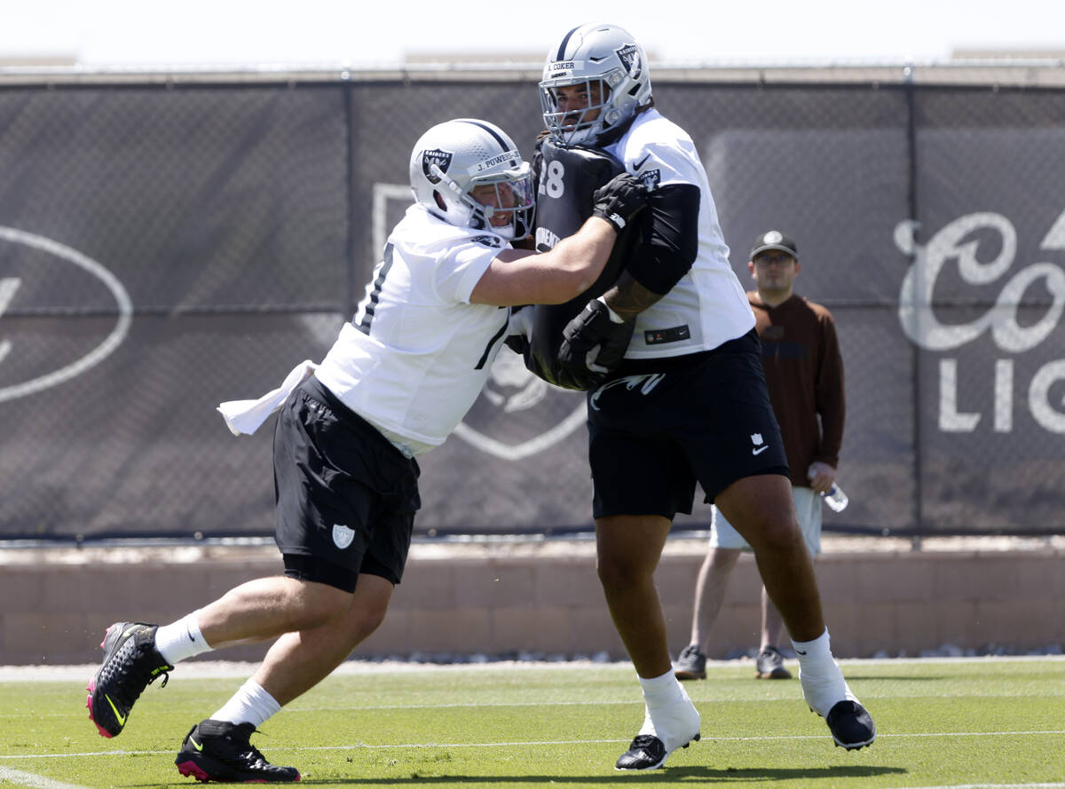 Raiders rookies guard Jackson Powers-Johnson (70), left, blocks offensive tackle Andrew Coker ( ...