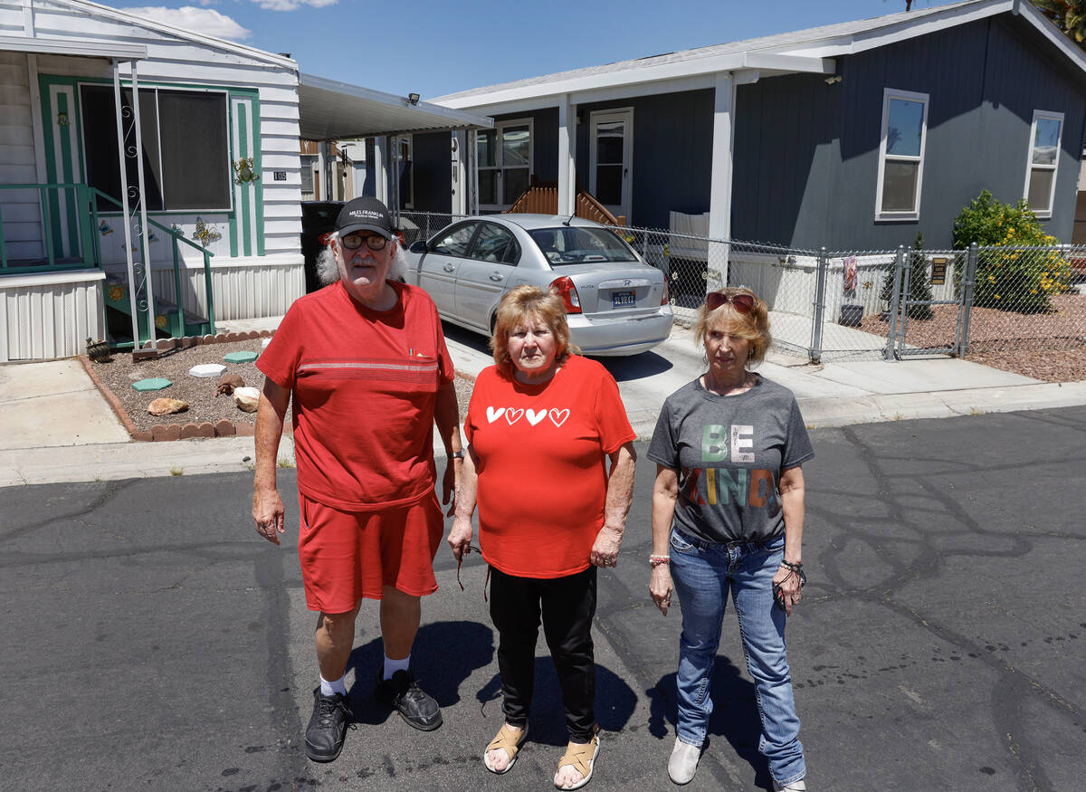 James Hatland poses for a photo with Risa Sykes, center, and Wendy Nelson in front of Sykes' an ...