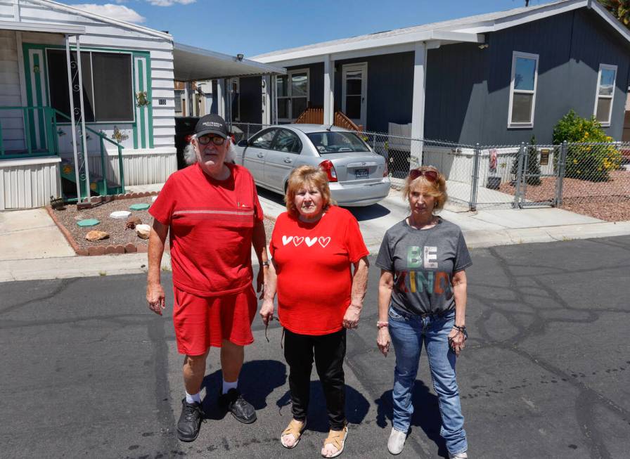 James Hatland poses for a photo with Risa Sykes, center, and Wendy Nelson in front of Sykes' an ...