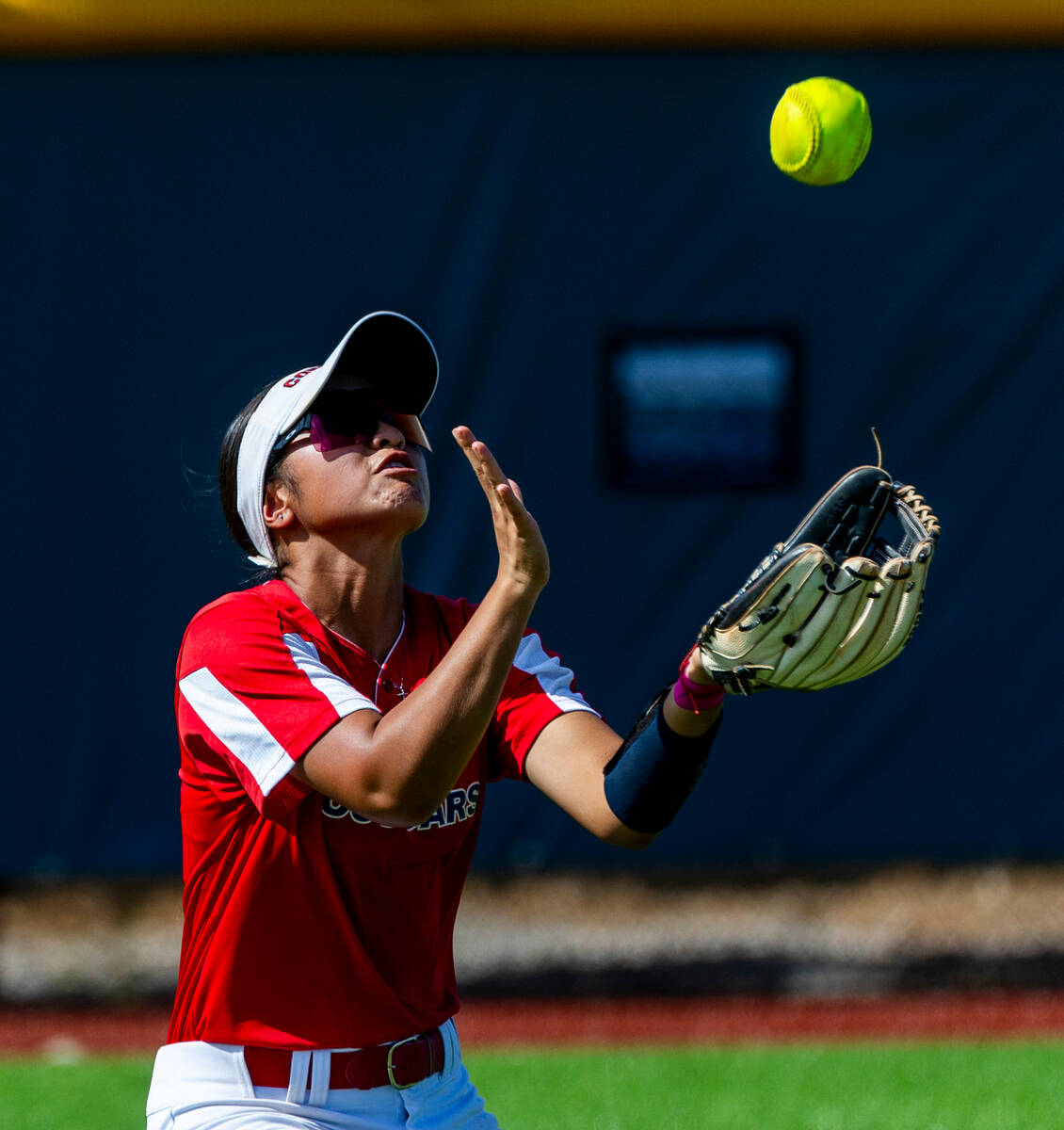 Coronado outfielder Alohi Mundon (8) eyes a pop fly against a Palo Verde batter during the thir ...