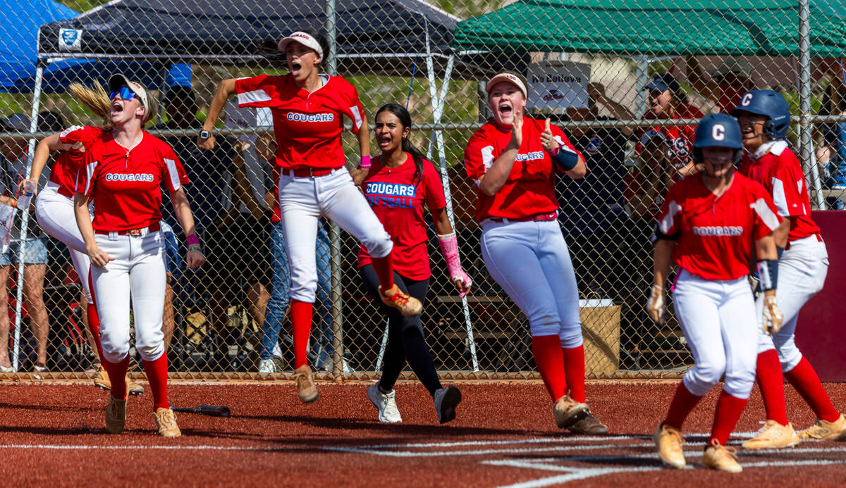 Coronado teammates cheer for a grand slam against Palo Verde during the fourth inning of their ...