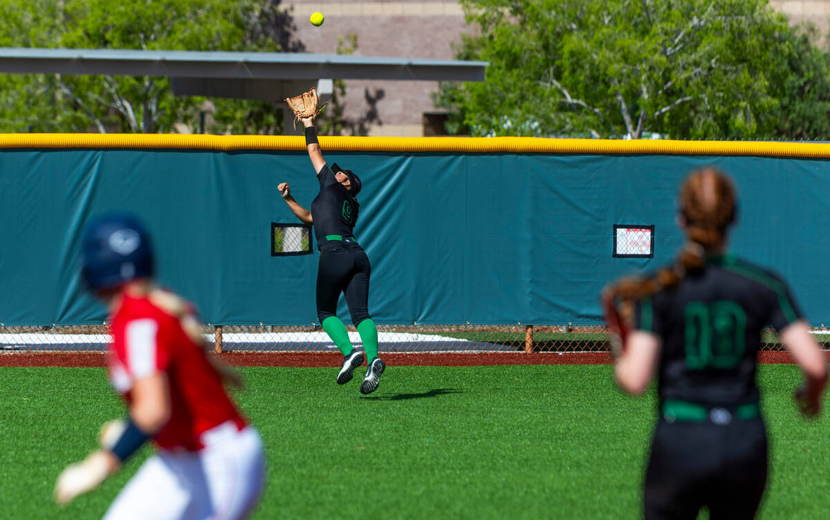 Palo Verde outfielder Payton Liposky (9) runs back as a long fly ball gets past her from Corona ...