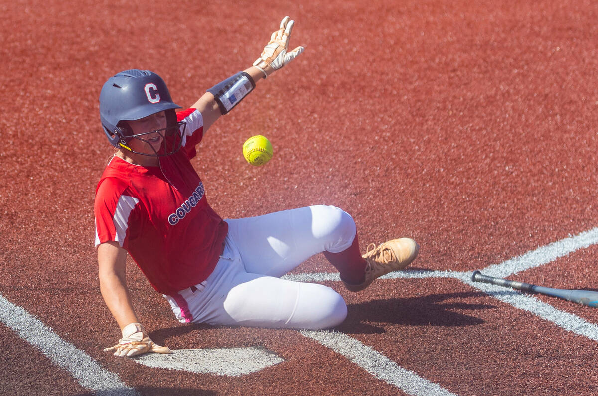 Coronado runner Sophie Bendlin (6) slides safely at home against Palo Verde during the sixth in ...